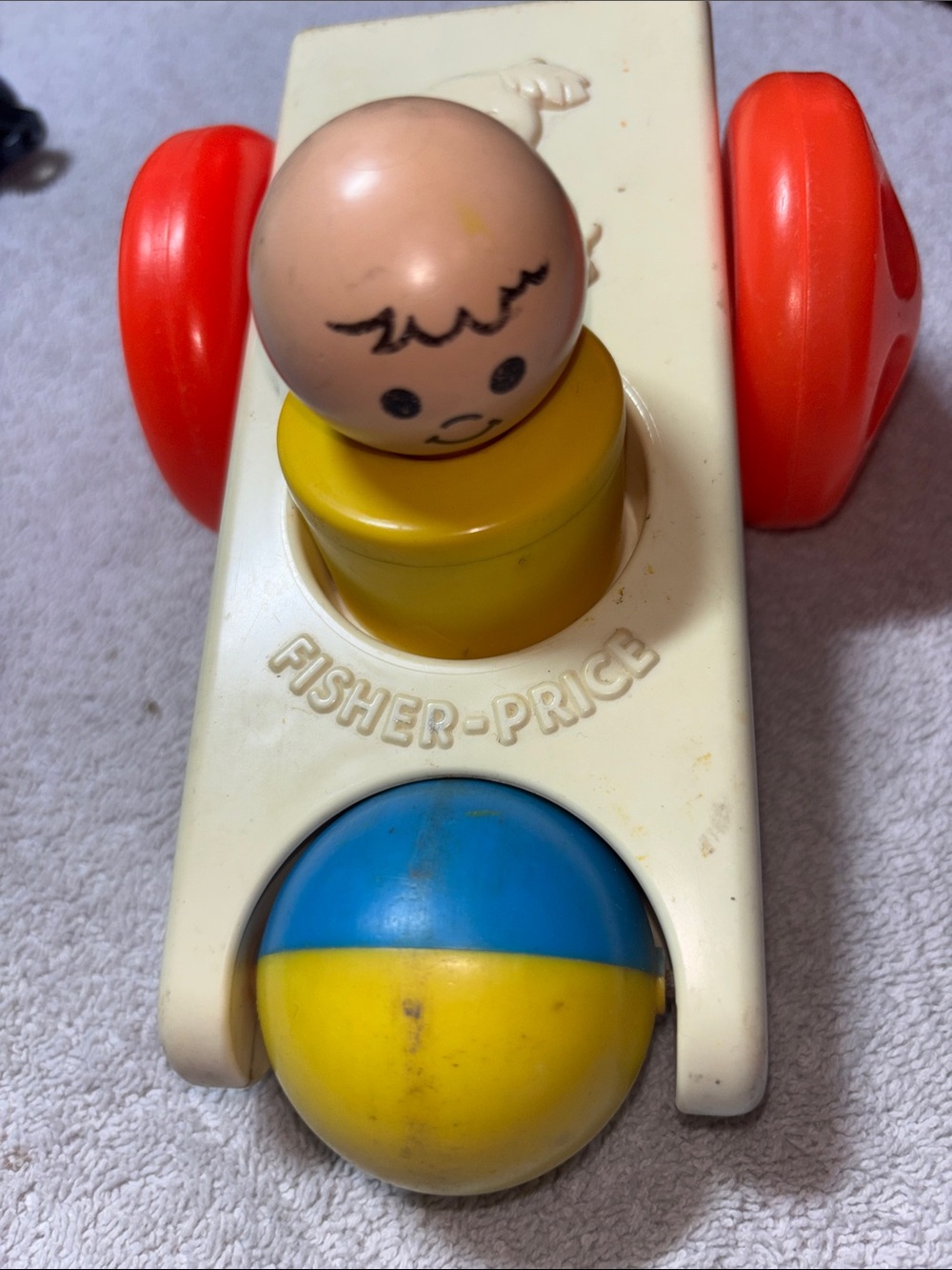 Fisher-Price Vintage Cream, Yellow, Red & Blue Push-Pop Toy